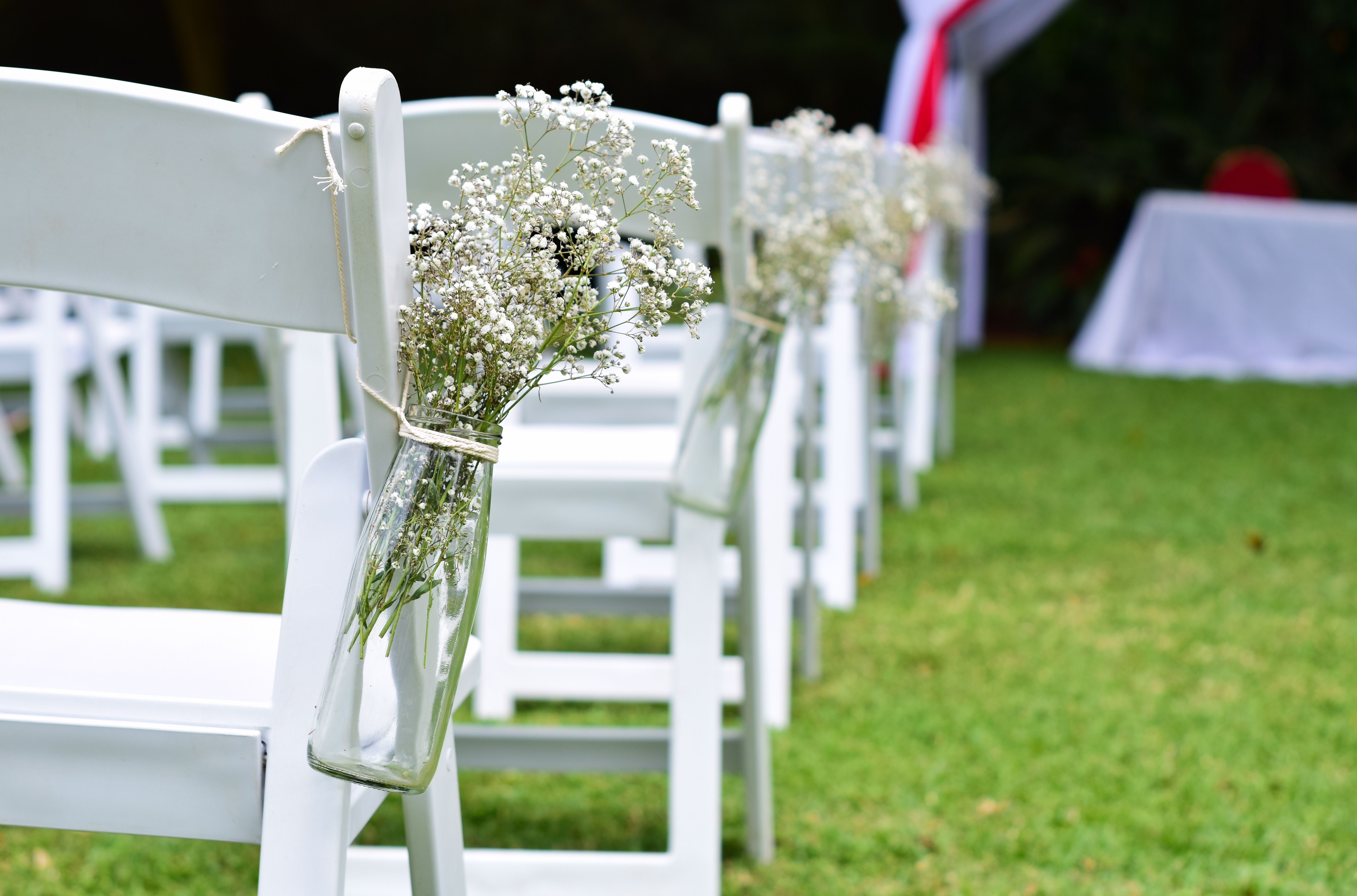 Chairs set up under string lights for an evening event